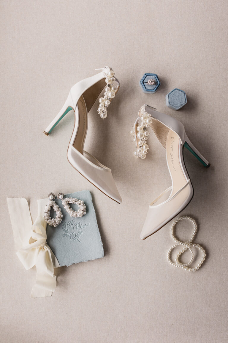 a pair of white high heeled shoes and pearl necklaces. Bushel Peck Photo. Austin wedding photographers Texas Photographers Photography Services
