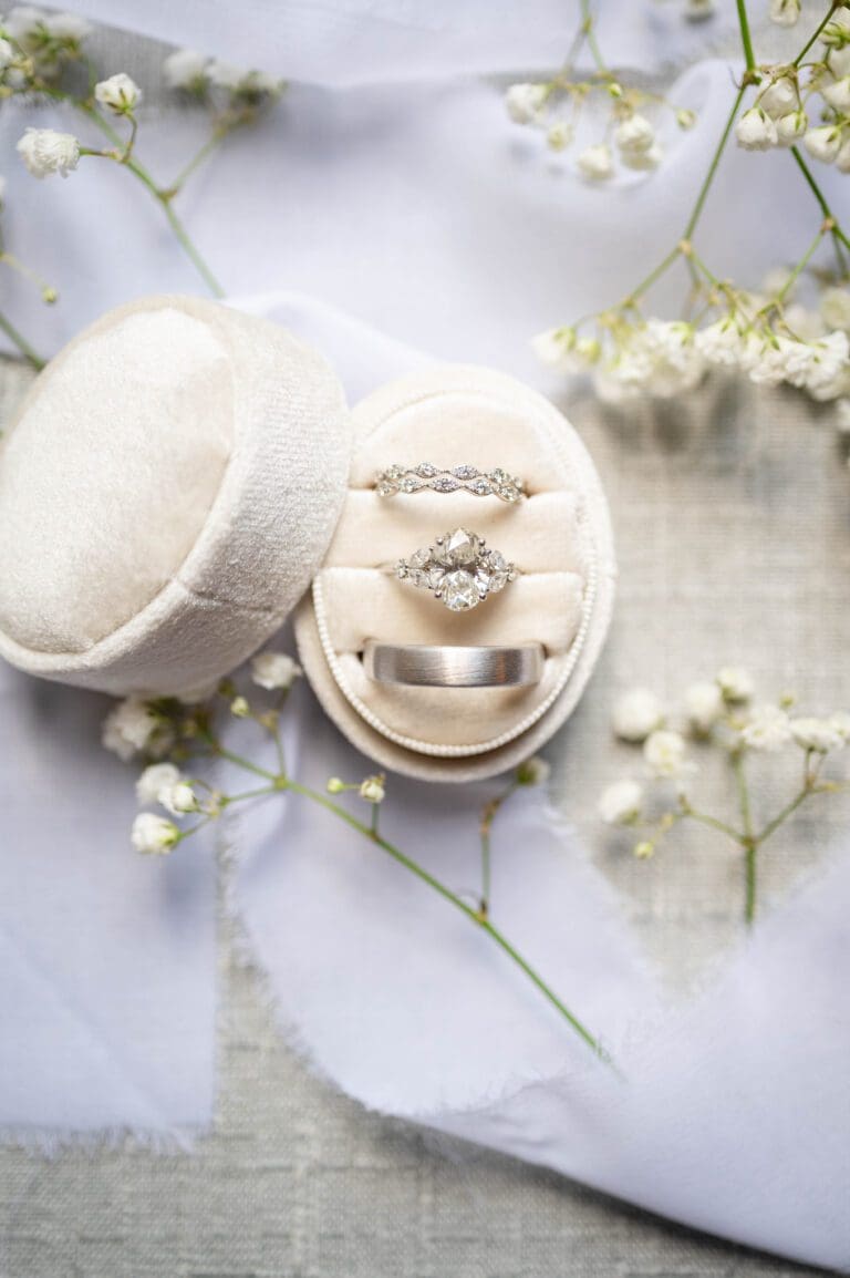 a ring in a box with flowers. Wedding Photography by Bushel + Peck Photo.