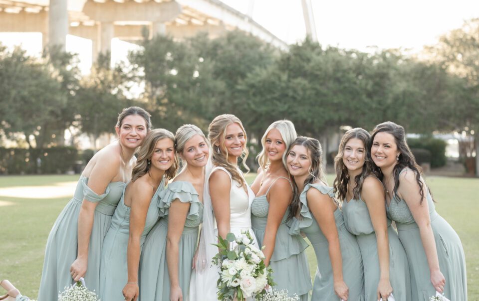 a group of women in dresses posing for a picture