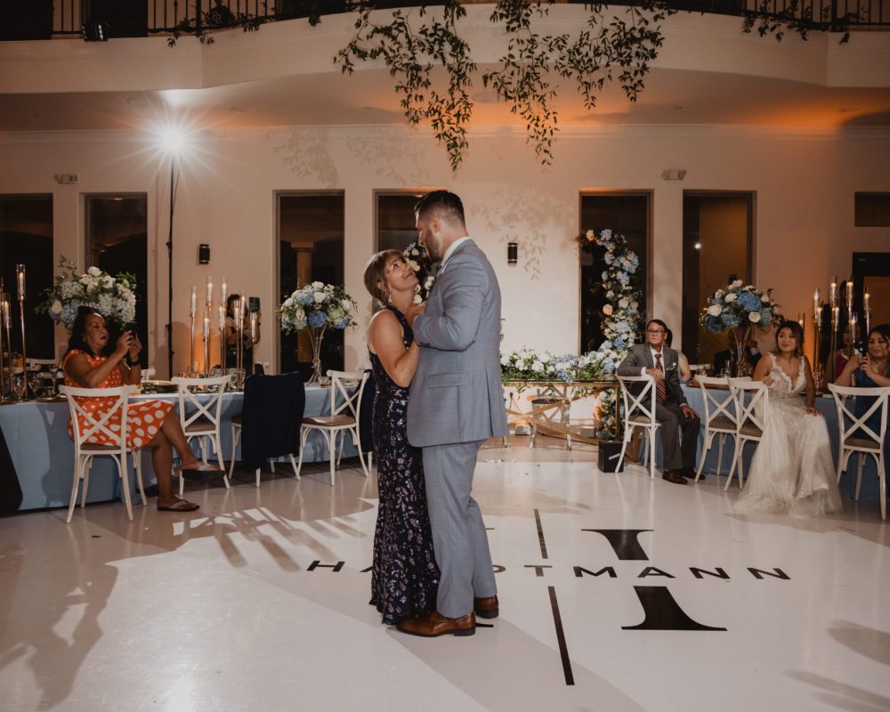 mother and son dancing at wedding reception to mother son dance song